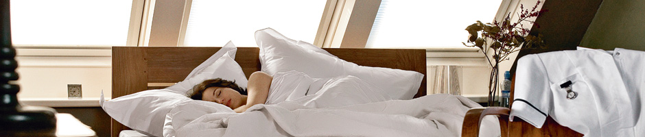 Woman sleeping in loft conversion